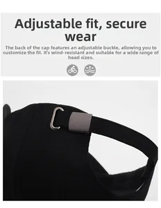 Detail of adjustable metal buckle and breathable fabric on the black baseball cap