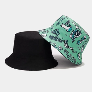 Double-sided sun protection bucket hats in black and mint green with graffiti prints