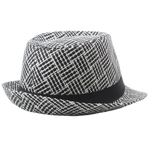Close-up of the breathable black and white woven texture on a fedora sun hat