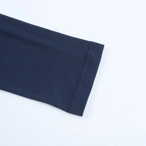Detail of double-needle stitching on dark blue knitted dress cuff with premium texture