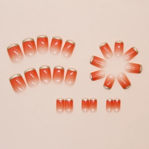 Detail of 24pcs pink gradient press-on nails with delicate french gold rim decoration