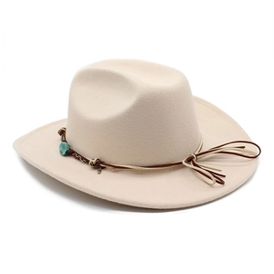 Beige wide brim cowboy hat with brown leather band and turquoise stone accents