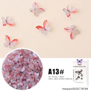 Macro view of multi-color resin 3D butterfly nail art accessories with glitter finish