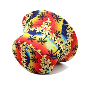 Detail of tropical palm tree print on a gradient summer sun protection bucket hat