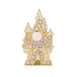 Detailed view of a gold castle brooch with colorful rhinestones and pink clock face