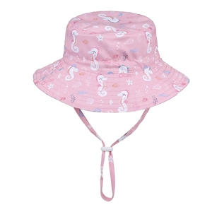 Detailed close-up of pink sun hat with ocean prints and adjustable windproof strap