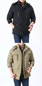 Detail of outdoor hooded parka showing front embroidery and functional multi-pocket design