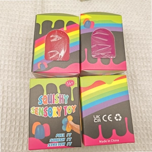 Macro view of squishy sensory toy in rainbow drip packaging with CE and UKCA safety marks
