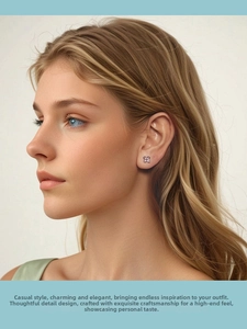 On-ear view of 925 silver lilac flower earrings with purple crystal petals for women