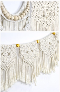 Close-up of bohemian macrame wall hanging with handmade cotton rope weave and wooden beads