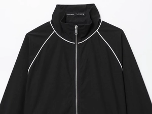 Detail shot of the stand collar and brand neck label on the black nylon puffer jacket