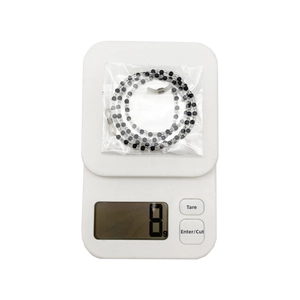 Detail view of 8g black and white beaded eyewear chain with silicone ends in packaging