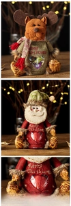 Detail of Christmas candy bags featuring Santa and reindeer with a heart shaped window