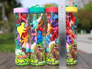 Mini dinosaur toy set in transparent cylinder tube with ruler showing 22cm height
