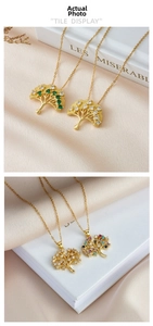 Detail of tree of life necklaces with colorful cubic zirconia and gold titanium steel chains