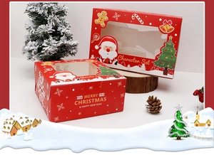 Detail of red Christmas cupcake boxes with clear windows and festive holiday patterns