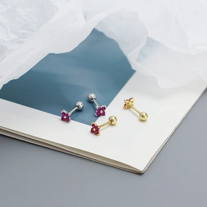 Macro view of red clover flower ear studs with sparkling zircon and screw back design