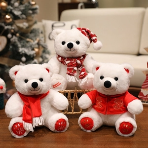 Three plush white Christmas teddy bears wearing red scarves and festive holiday hats