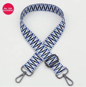 Close-up of ethnic adjustable shoulder strap with blue wave weave and metal hooks