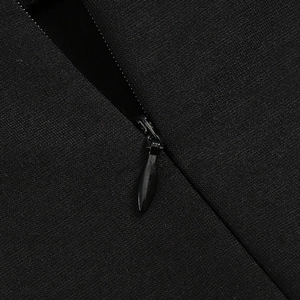 Detail of the high-quality invisible zipper on a black evening dress with fine fabric texture