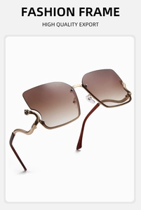 Detail of creative wavy metal temples and brown gradient lenses on square sunglasses