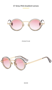 Detailed view of round punk sunglasses with pink gradient lenses and gold metal frames