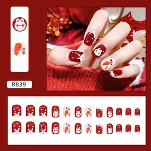 Short burgundy rabbit press-on nail set with white snowflake and carrot festive designs