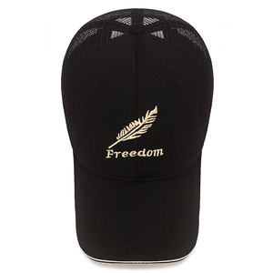 Black sandwich mesh baseball cap with golden feather embroidery and Freedom text