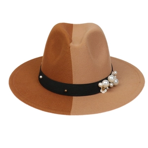 Close-up of dual-tone wool felt fedora with pearl and floral metal accents on black ribbon