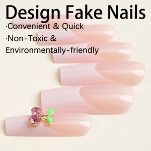 Pink gradient French press-on nails with long coffin shape and cherry rhinestone accent