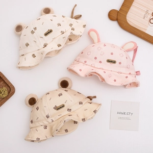 Cute bear and rabbit baby bucket hats in cream, brown, and pink with adjustable drawstrings