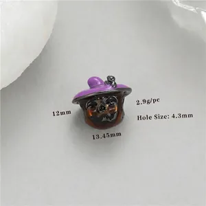 Macro detail of pumpkin wizard charm with purple hat and 4.3mm hole for DIY jewelry