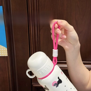 Close-up of portable pink lanyard on white stainless steel cartoon bottle for kids