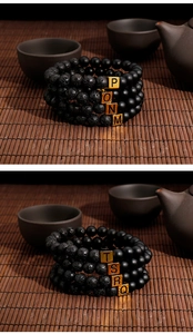 Detailed view of lava stone bracelets with gold letter beads on a bamboo mat