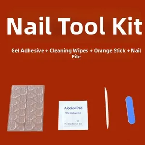 Nail application kit with adhesive tabs, prep pads, file and stick on red background