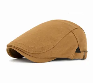 Khaki cotton newsboy cap detail showing twill fabric texture and adjustable metal buckle