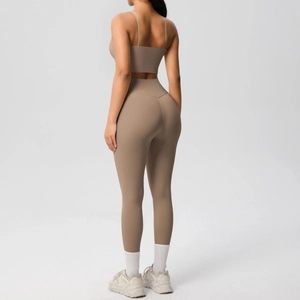 Detailed back view of a women's earth-toned yoga set with thin straps and high waist leggings