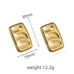 Detail view of gold geometric rectangular earrings measuring 30mm by 19mm with a polished finish