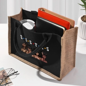 Detail of black linen tote bag with SISTERS text and durable hemp rope handles
