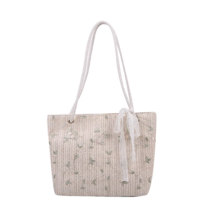 Minimalist straw woven tote bag with green floral embroidery and lace ribbon for summer