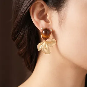 Vintage goldfish stud earrings with amber stone and rhinestone in gold plated finish