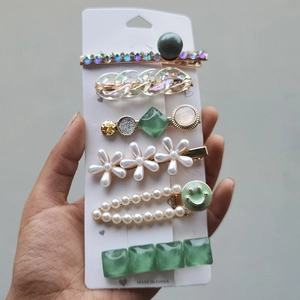 Detail of candy color hair clip set with pearls, rhinestones, and floral designs