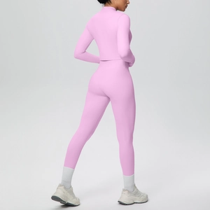 Rear view of pink yoga set showing slimming high waist leggings and long sleeve cropped top