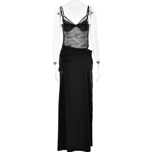 Detail of elegant black lace splicing and sheer corset top on a long slip dress