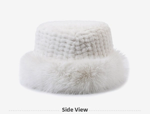 Detail view of white plush bucket hat with woven patterns and soft faux fur brim