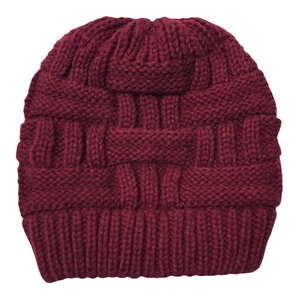 Close-up of chunky basket weave and cable knit pattern on burgundy ponytail beanie hat
