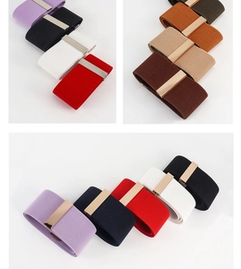 Close-up of high-elastic waist belts with rectangular metal buckles in various colors