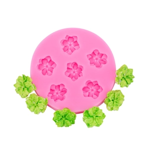 Roze siliconen zonnebloem mal met zes bloemvormpjes voor taartdecoratie en klei