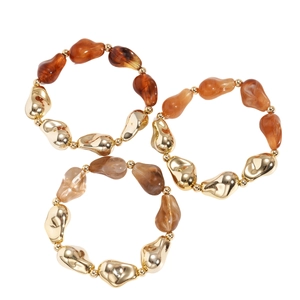 Three-piece set of retro amber acrylic beaded bracelets with geometric gold metal accents