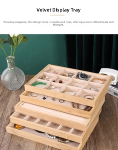 Detailed view of bamboo jewelry trays with velvet lining for rings and necklaces
